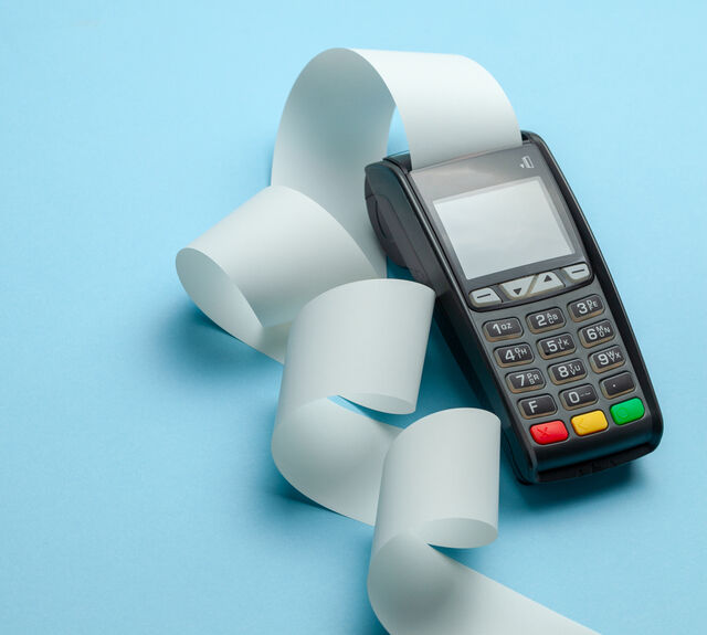 Payment terminal printing a paper receipt